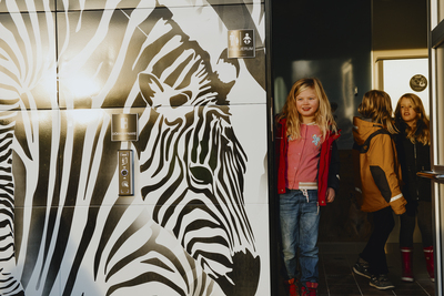 Children in public toilet with Zebra design