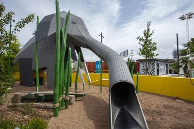 Toilet and slide share a playground