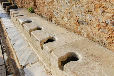 Public toilets - latrines in the ancient Greek city of Ephesus.jpg